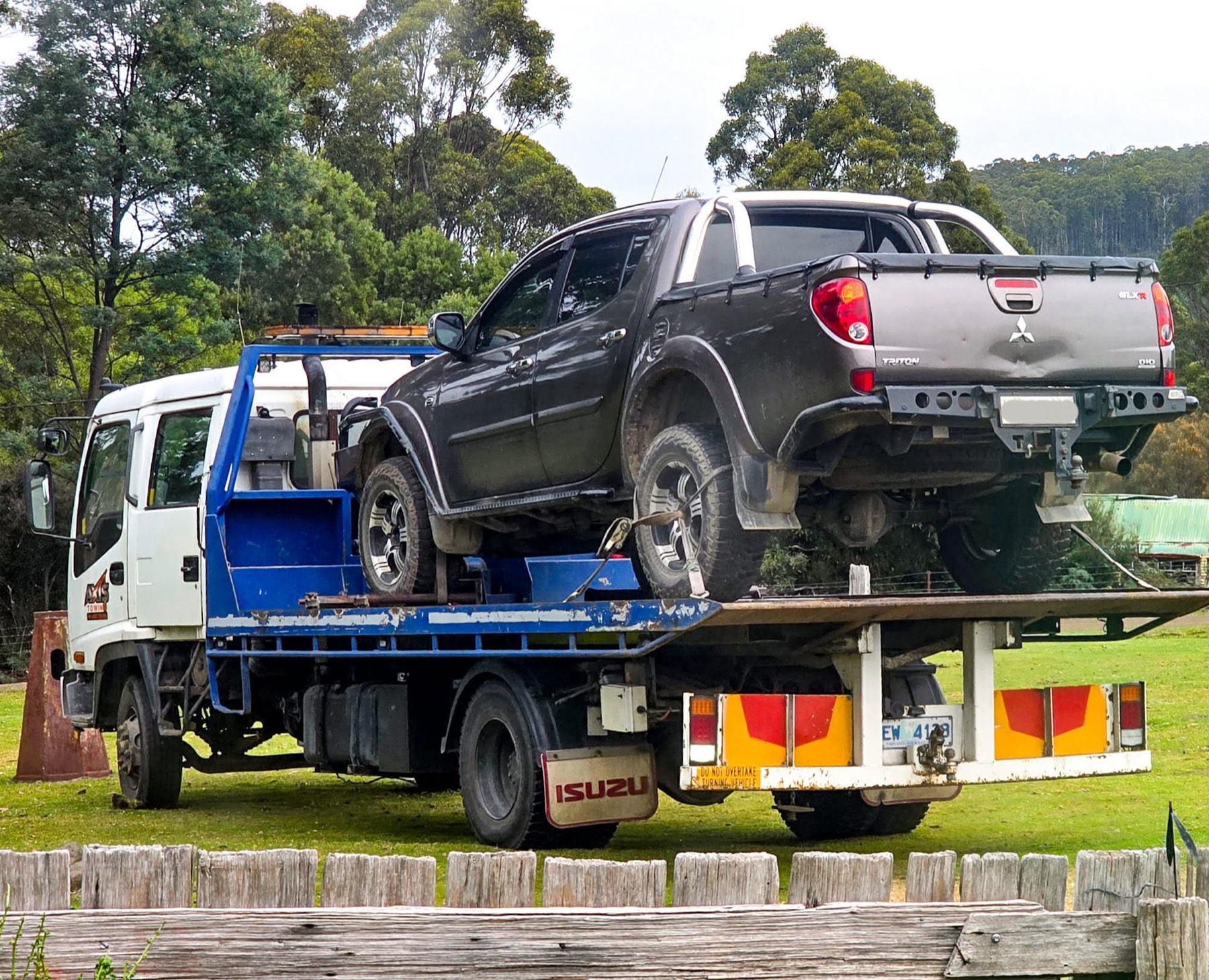 Axis Towing tilt-tray truck carrying a Mitsubishi Triton ute